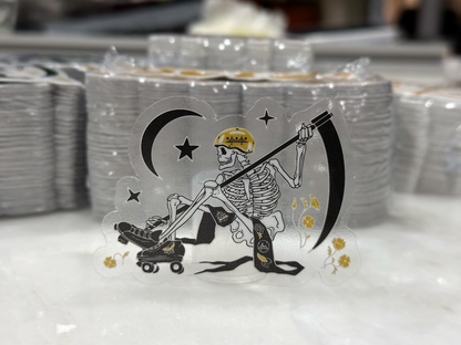 Clear sticker featuring an opaque white skeleton in front of stacks of stickers
