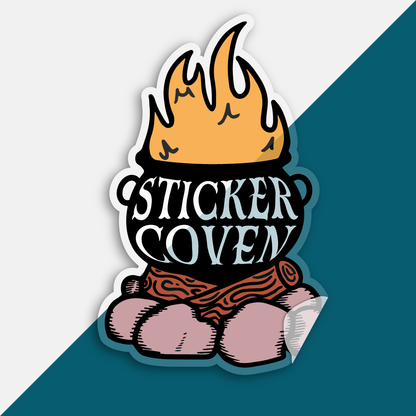 Clear die cut sticker with a cauldron on a campfire graphic over a split blue and white background. Text on the sticker reads "Sticker Cauldron"